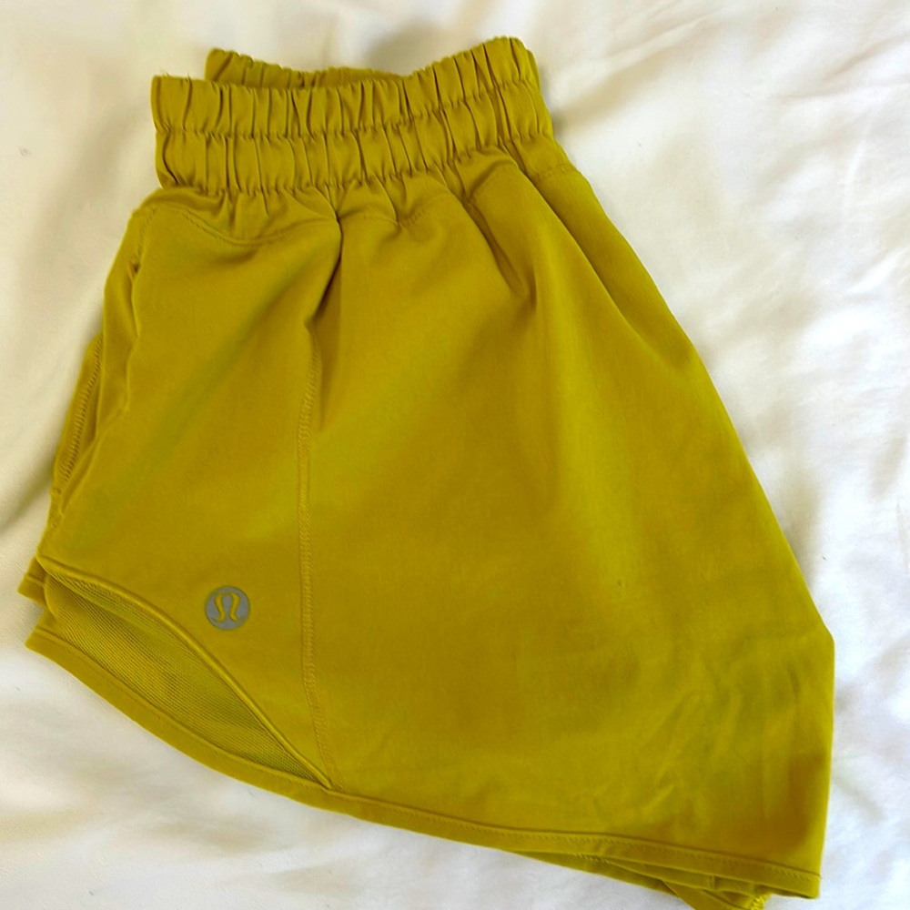 Golden yellow lululemon low rise hotty hot shorts 2.5”